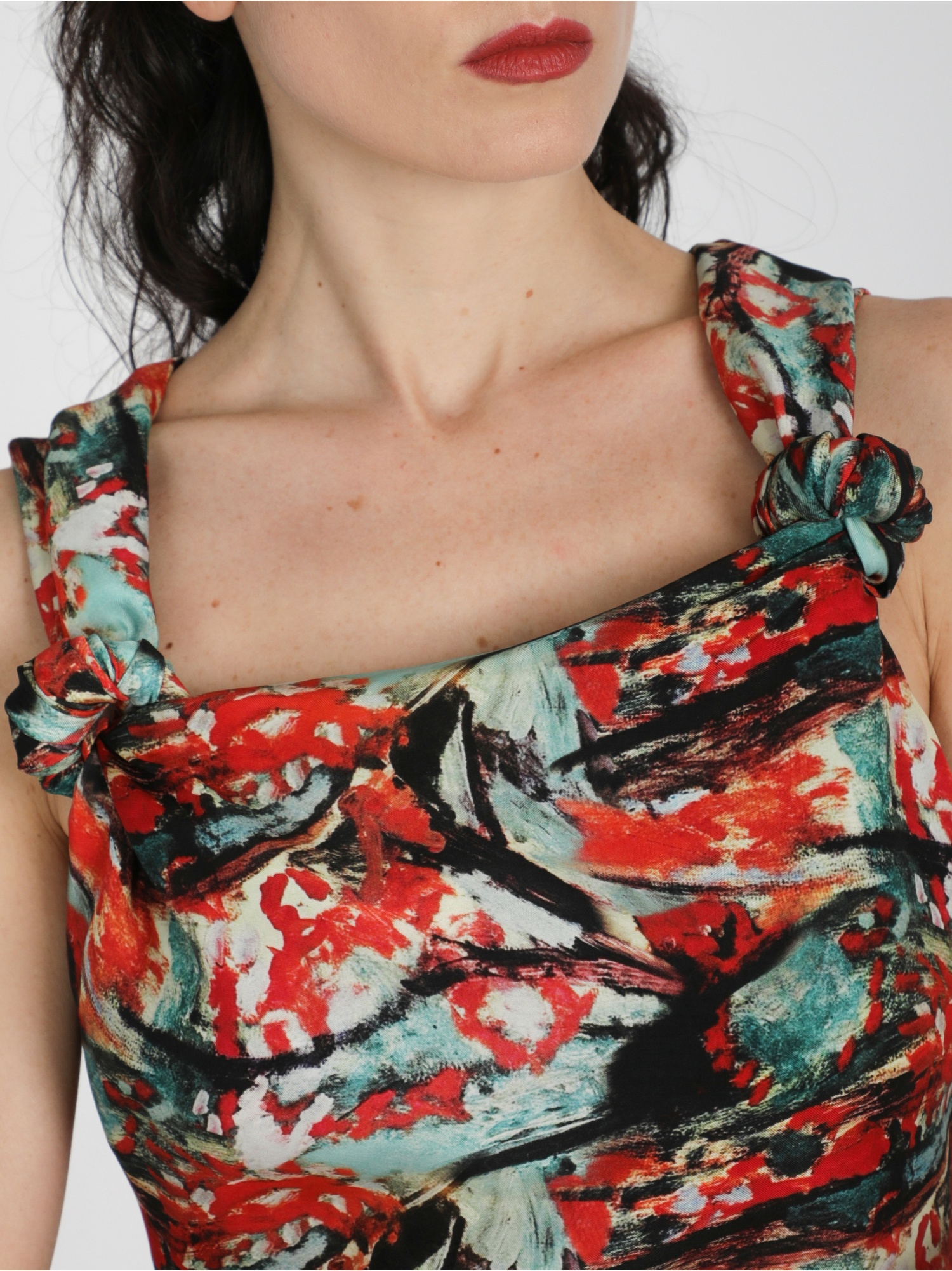 Woman dress, long in abstract pattern, sleeveless, square neckline, with knots and side slit. Green, red and black color. 100% natural cupro, made in Italy. For sale online!