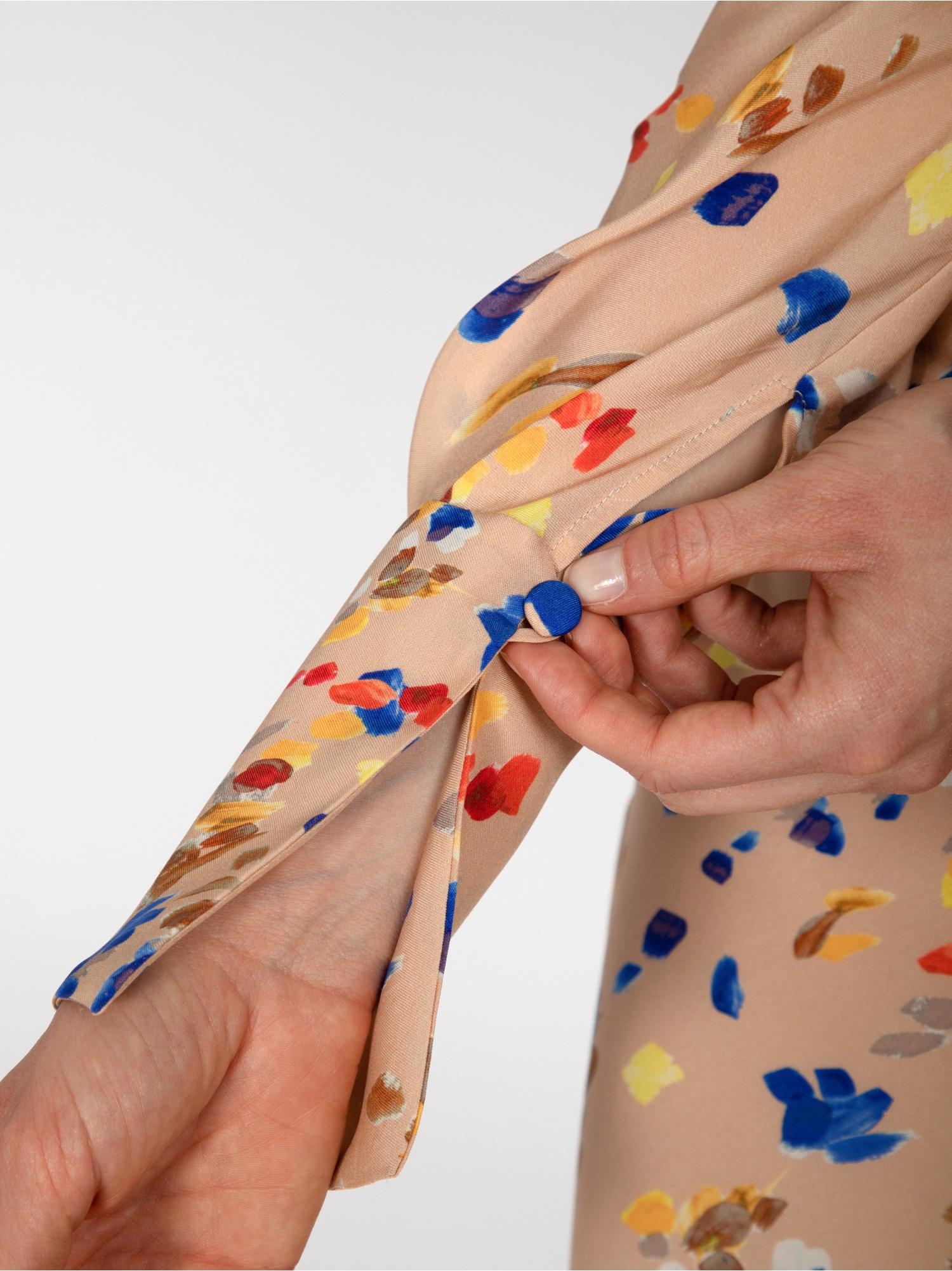Woman dress, long in floral pattern, long sleeves and cuffs, square neckline with open back and laces. Beige, blue and red color. 100% natural cupro, made in Italy. For sale online!