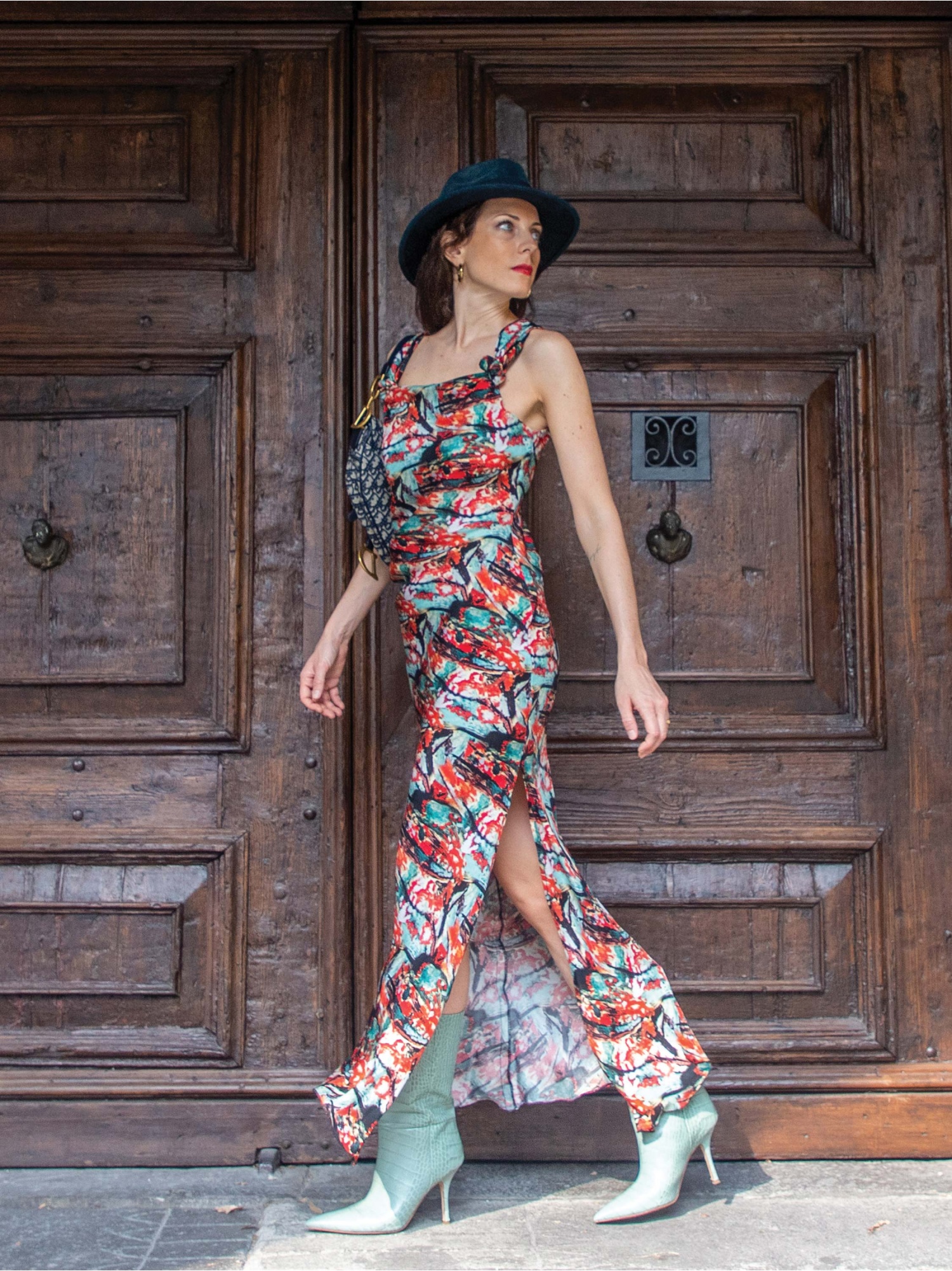 Woman dress, long in abstract pattern, sleeveless, square neckline, with knots and side slit. Green, red and black color. 100% natural cupro, made in Italy. Buy online!