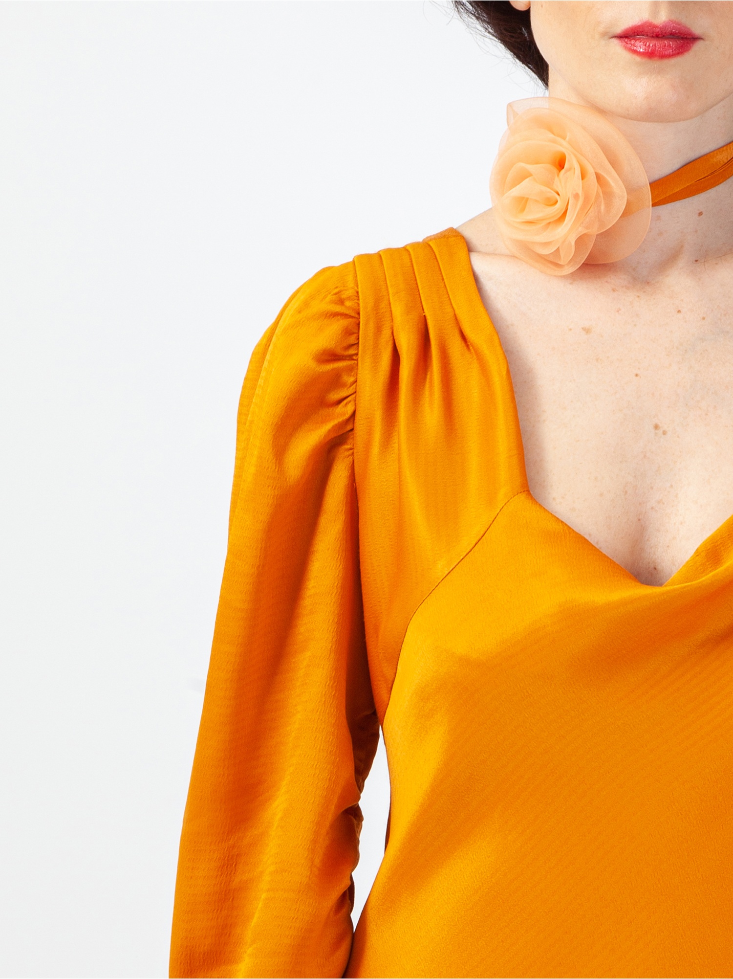 Soft orange satin woman dress, orange long dress, with gathered long sleeves and square neckline, laces at the waist and back out. Orange colour. 100% viscose, made in Italy. Buy online!