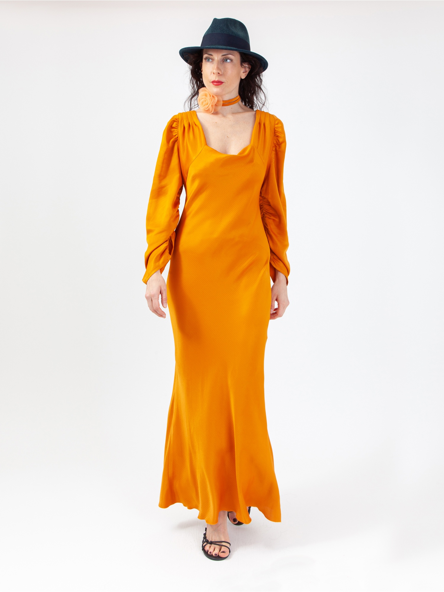 Soft orange satin woman dress, orange long dress, with gathered long sleeves and square neckline, laces at the waist and back out. Orange colour. 100% viscose, made in Italy. For sale online!