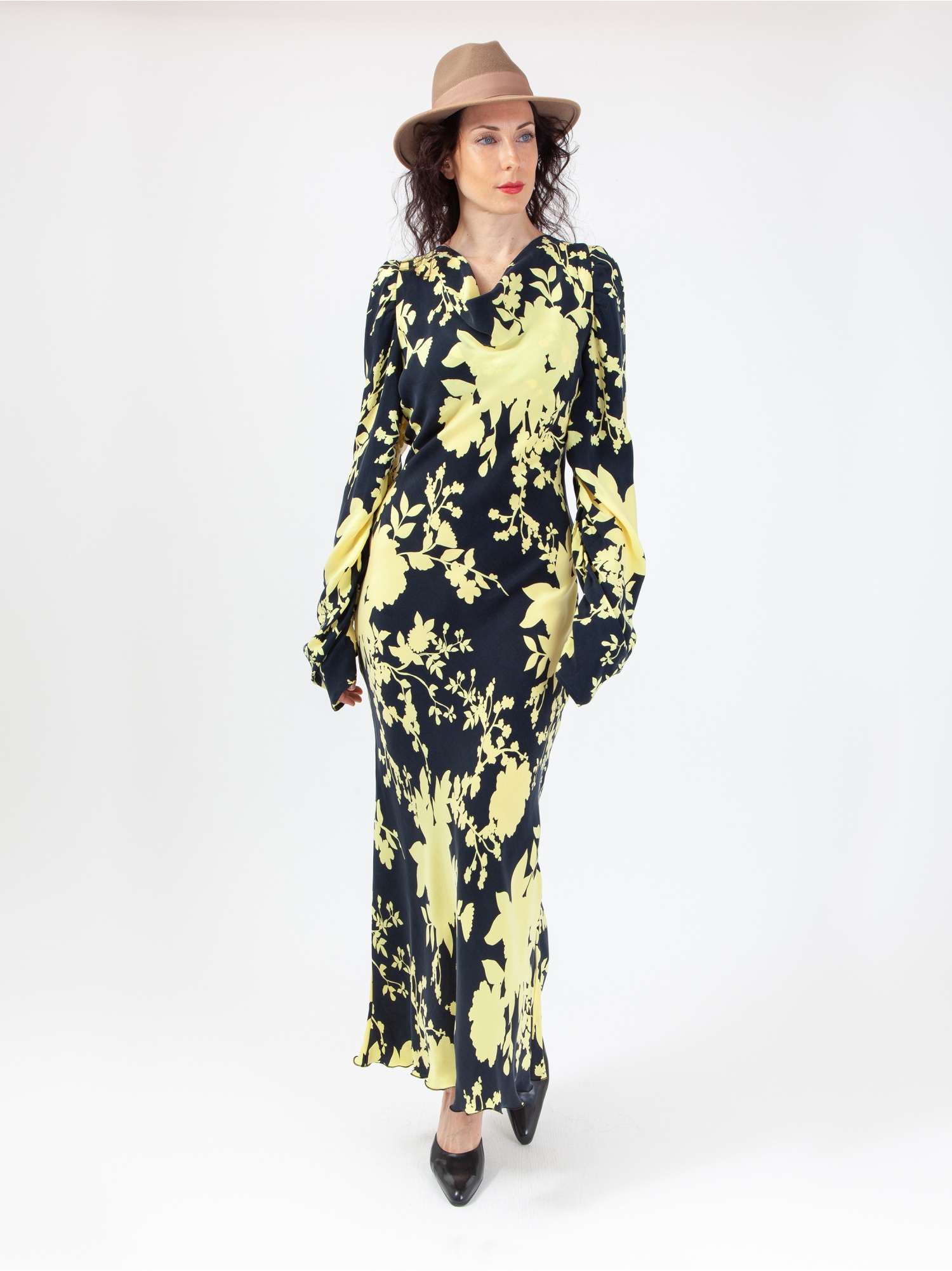 Women's soft dress in floral pattern, black and yellow floral print midi dress, with long gathered sleeves and cowl neckline, ties at the waist. Yellow and black colour. 100% natural cupro, made in Italy. Buy online!