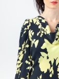 Women's soft dress in floral pattern, black and yellow floral print midi dress, with long gathered sleeves and cowl neckline, ties at the waist. Yellow and black colour. 100% natural cupro, made in Italy. Buy online!