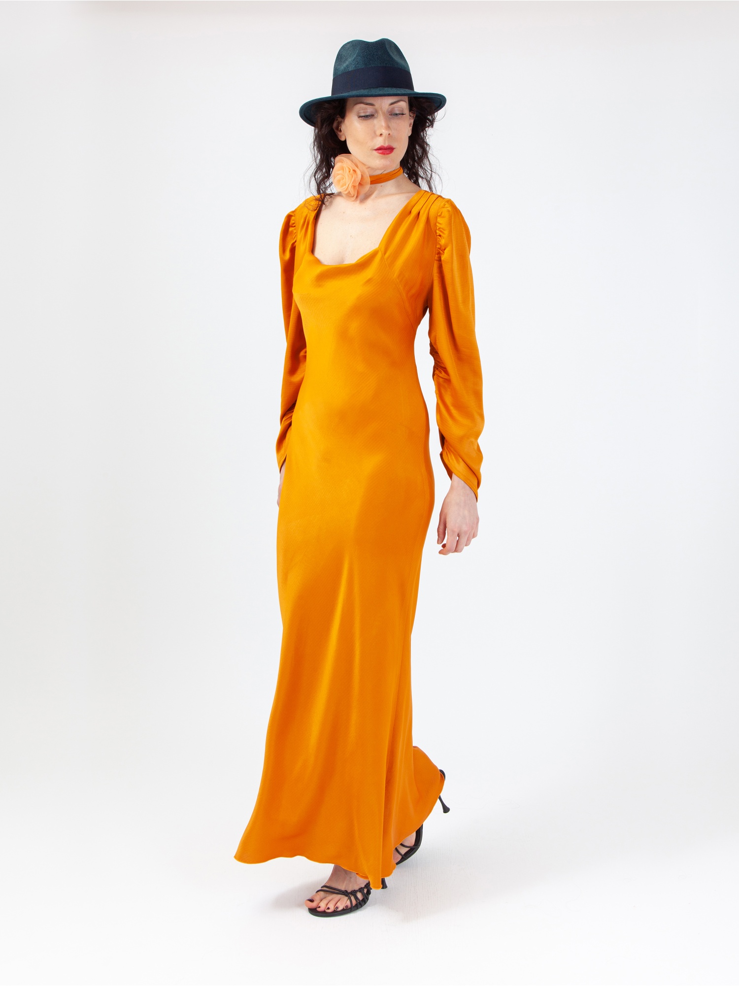 Soft orange satin woman dress, orange long dress, with gathered long sleeves and square neckline, laces at the waist and back out. Orange colour. 100% viscose, made in Italy. Buy online!